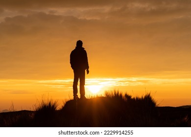 Lonely man watching the sunset