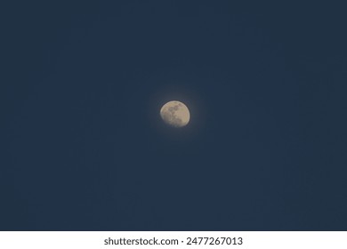 Lonely moon in the empty sky background