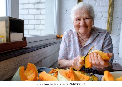 Lonely Old Woman Cuts And Pills Yellow Pumpkin, Cooking Pumpkin Soup, Retirement Life, Selective Focus