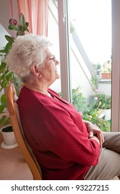 Lonely Old Woman Looks Out The Window