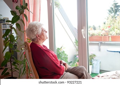 Lonely Old Woman Looks Out The Window