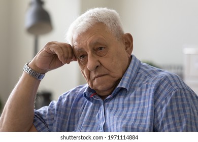 Lonely Retirement. Headshot Of Sad Upset Elderly Male Feel Desperate Tired Having Mental Health Problems. Depressed Old Man Pensioner Lost In Bad Thoughts Grieving Alone Suffering Of Senile Dementia