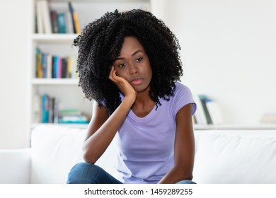 Lonely And Sad African American Woman Indoors At Home