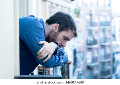 Lonely Sad Man Staring Outside House Balcony Feeling Depressed Distress And Miserable. Suffering Emotional Crisis Thinking About Difficult Important Life Decision In Men Depression And Mental Health.