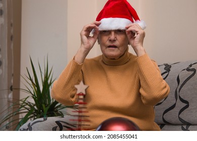 lonely senior woman with christmas santa claus hat stressed and bored