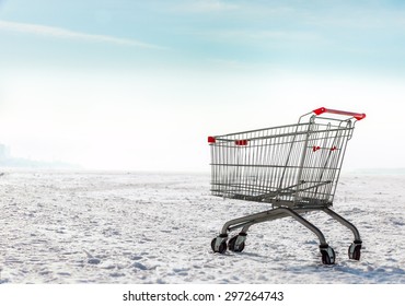 Lonely Shopping Cart On Ice And Snow