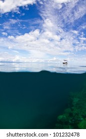 A lonely small boat is moored up at the great barrier reef in Australia.