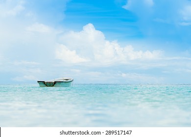 Lonely Small Boat In Ocean.