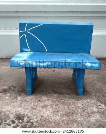 The lonely stone chair bench seat,blue cement chair, long  bench blue,square bench on cement floor in the park, concept of relaxing