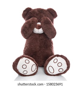 Lonely teddy bear covering eyes isolated on white background - sadness or problems concept