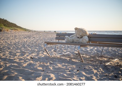 A Lonely Teddy Bear Left Of A Bench At Jurmala Beach