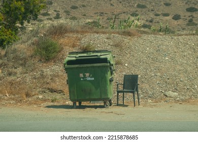 Lonely trash bin with chair