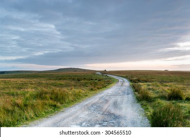 A lonely winding track through desolate moorland on Bodmin Moor in Cornwall