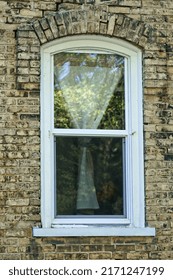 Lonely Window In A Tan Brick Wall