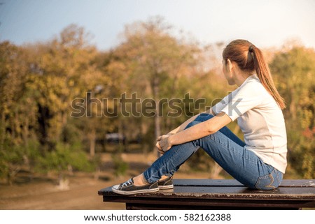 Lonely woman sitting on the chair.
