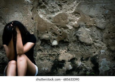 Lonely Woman Sitting On The Floor Near Old Wall Vintage Tone,sad Depression,violence, Bipolar Concept,hard Contrast