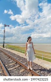 Lonely Woman Stand Alone At The Railway To Feel Happy And Funny. The Words Means That 