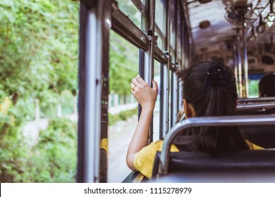 Lonely Woman Travels By Bus Alone Watching Through The Open Window