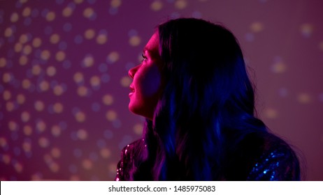 Lonely Young Woman Listening Favorite Romantic Song At Party, Sad After Breakup