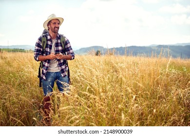 Loner Male Traveller Exploring The Nature In The Mountains