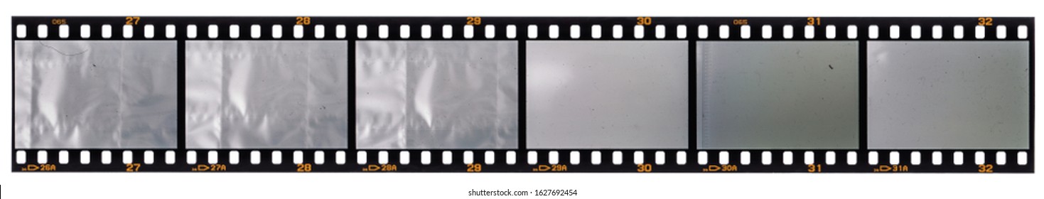 long 35 mm film strip isolated on white background with empty or blank cells for your social media content, just blend in your photos here, vintage photoplaceholder, dia positive material.