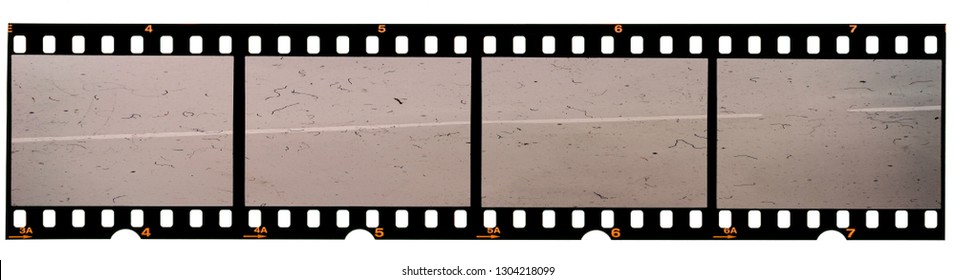 long 35mm film strip or 135 film material on white background, real scan no macro photo, 4 empty photo placeholder 