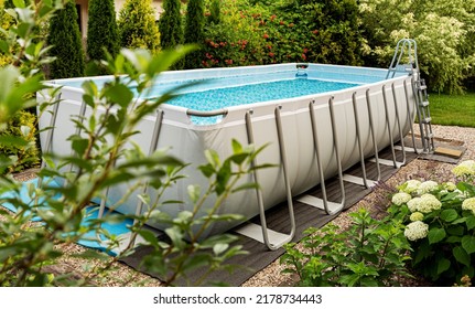 Long, Above Ground, Rectangular, Rack (frame) Swimming Pool Outdoor In The Garden. Summer Holiday (vacation) And Recreation.