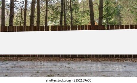 Long Advertising Blank White Billboard Mounted On Wooden Fence Of Forestry Management Outdoor