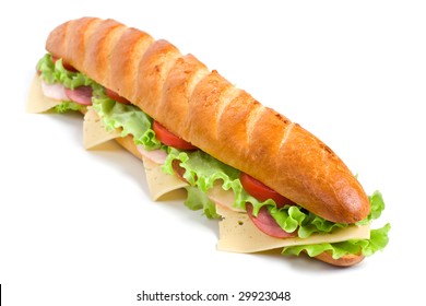  long baguette sandwich with lettuce, slices of fresh tomatoes, ham, turkey breast and cheese