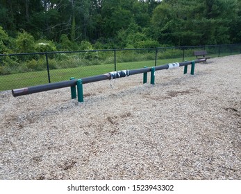 Long Balance Beam At Playground With Brown Wood Chips