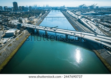 Long Beach, CA - Dec. 12, 2023: An aerial view of the Shoemaker bridge that crosses the Los Angeles River at Seventh Street. 
