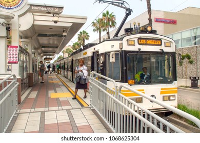 LONG BEACH, CA - July 15, 2017:  Passengers Use The Blue Line Light Rail Metro Train System At Long Beach Subway Station In Los Angeles