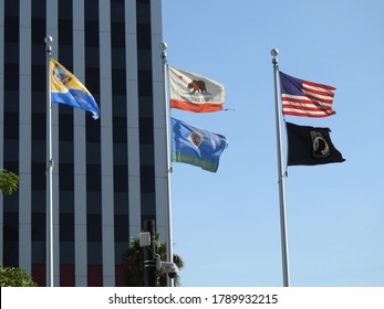 Long Beach, CA / USA - August 4, 2020: Flags Flying Outside Long Beach City Hall.          