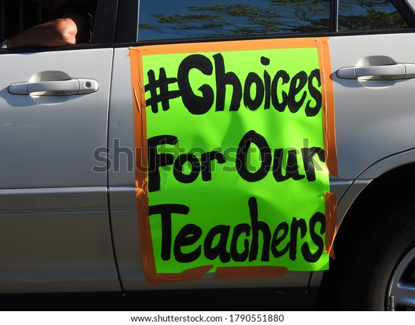 Long\
Beach, CA / USA - August 5, 2020: Sign on a car participating in\
the Parent & Teachers Car Caravan in Solidarity for Our LBUSD\
Teachers outside the LBUSD Board Meeting.         \
