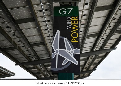 LONG BEACH, CA U.S.A. - MAY 3, 2022: Photo Of A Wind Power Sign Under A Solar Panel Array In The Parking Lot At California State University Long Beach.