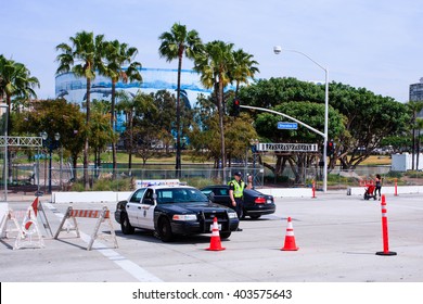 Long Beach, California/ USA- April 7, 2016 Preparations for the Grand Prix of Long Beach. Police Officer directing traffic.