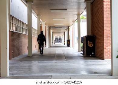 Long Beach, California/United States - 05/24/2019: A Lone Student Walks The Halls At California State University Long Beach