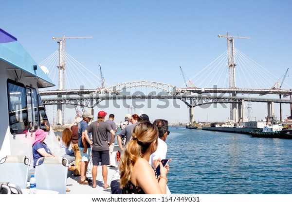 Long Beach, California/United States -\
09/07/2019: Looking up at the Gerald Desmond Bridge, including the\
new projected bridge behind under\
construction