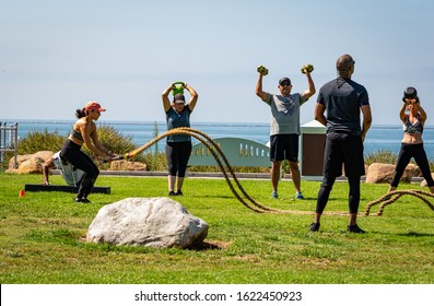 LONG BEACH, CA/U.S.A. - AUGUST 10, 2019: A Photo Of Fitmonster, Bootcamp Participants Exercising At A Class On The Bluffs In Long Beach, At The Corner Of Ocean And Junipero Streets.