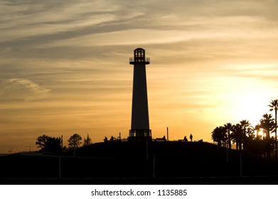 Long Beach Harbor Lighthouse Back Lit And Silhouetted By A Southern California Sunset