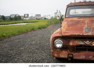 Long Beach Island, New Jersey, United States Of America, 02-18-2020 Ford V8 Vintage Red Truck On A Suburban Driveway In Summer