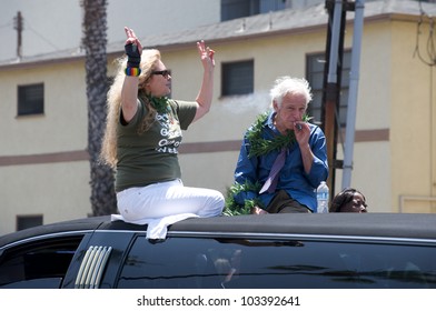 LONG BEACH - MAY 20: Older Man Smoking Marijuana On Top Of A Car During The Long Beach Lesbian And Gay Pride Parade 2012 On May 20, 2012 In Long Beach, California.