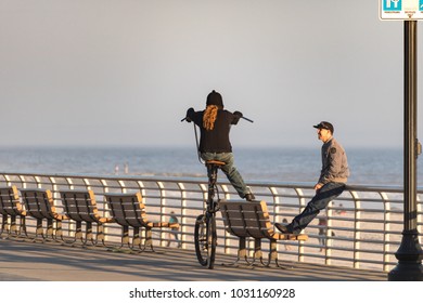 Long Beach, New York - 02/21/2018 : Man On An Oversized Tall Modified Beach Cruiser Bike On Long Beach Boardwalk.