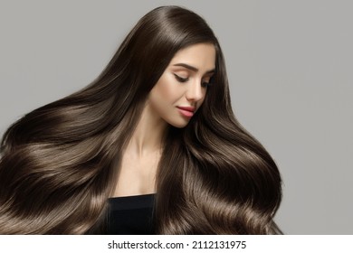Long beautiful wavy hair. Portrait of a woman with shiny blond hair. copycpase - Shutterstock ID 2112131975