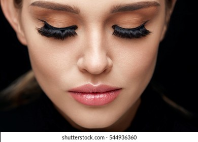 Long Black Eyelashes. Portrait Of Beautiful Woman Face With Closed Eyes And Thick Fake Eye Lashes. Closeup Of Sexy Girl With Smooth Skin, Fresh Facial Makeup. Beauty Cosmetics Concept. High Resolution