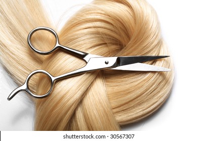 Long Blond Human Hair Close-up And Scissors