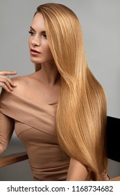 Long Blonde Hair. Beautiful Woman With Healthy Straight Hair