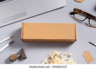 Long Brown Cardboard Box On Office Desk