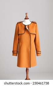 Long Brown Cashmere Women Coat With Wood Model On Grey Isolated