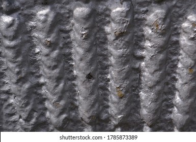 Long Bumps On A Gray Surface